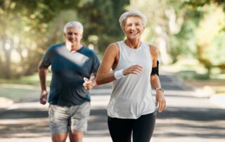 older couple jogging outdoors, embodying a heart smart lifestyle