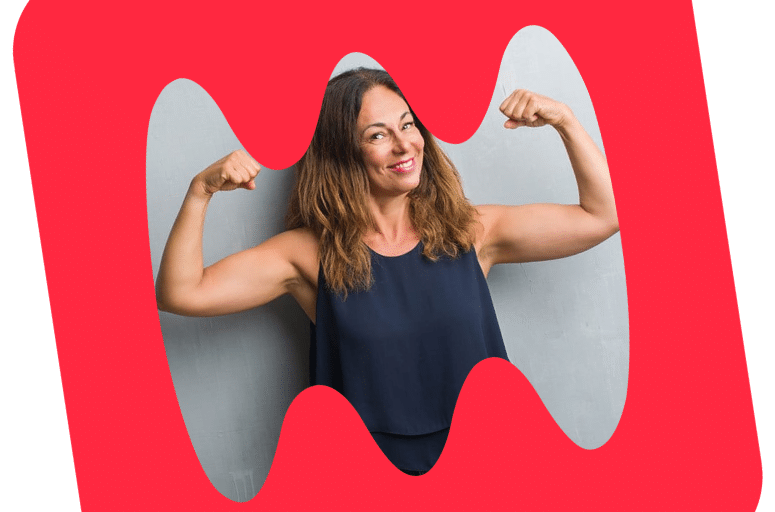 woman smiling and flexing her arms for the Heart Smart Challenge
