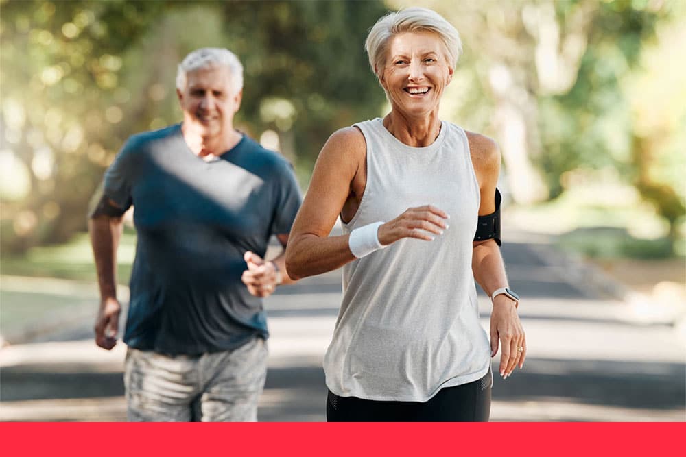 Programs_ older couple jogging outdoors, embodying a heart smart lifestyle