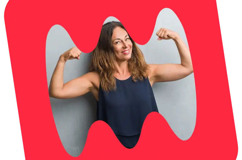 woman smiling and flexing her arms for the Heart Smart Challenge